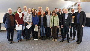 Group photo of long-serving LS telcom employees honored during the New Year reception in Lichtenau.