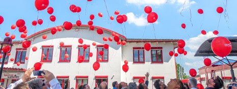 2017: LS telcom celebrates its 25th company anniversary Picture showing a big amount of red balloons that have been raised by our customers in front of the LS telcom premises.